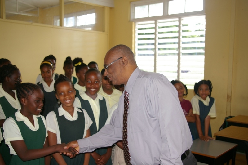 Premier of Nevis , the Hon.Joseph Parry greeting school children at Ivor Walters